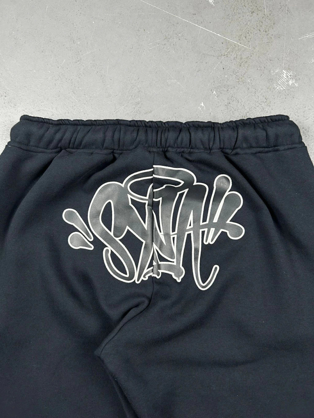 CONJUNTO SYNA WORLD LOGO